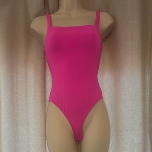 SKIMS hot pink body suit.